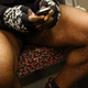 The wide angle of the leg-splay may indicate a moderate to large sized penis that makes the subject unable to close his legs